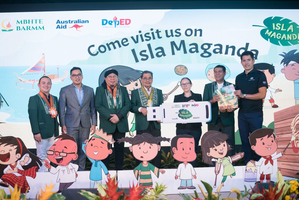 Minister Mohagher Iqbal is accompanied by Australian Embassy officials Ms. Vivienne Sykes and Mr. Peter Carreon at the Isla Maganda materials handover. Also present are MBHTE officials: Basic Education Director General Abdullah Salik Jr., Higher Education Director General Marjuni Maddi, Atty. Mojahid Guro, Chief of the Legal Division, and Mr. Mobarak Pandi, Chief of the Information and Communications Division. 